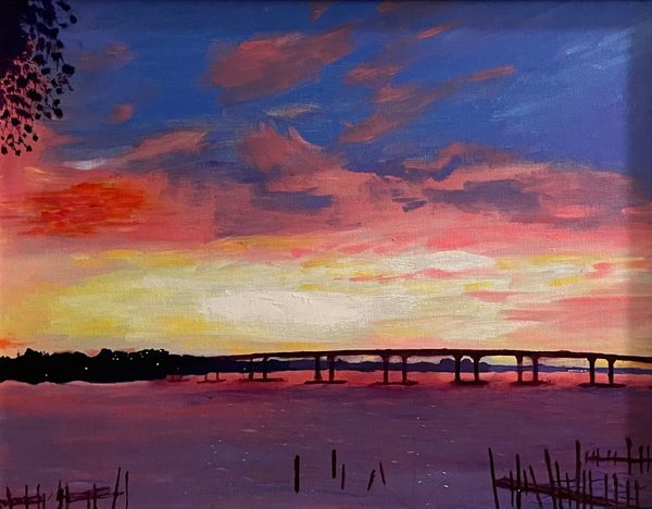 Sunset at the 10 Cent Bridge: painting of a vivid pink and gold sunset over water, with a long bridge and dark shoreline in silhouette and posts in the foreground.
